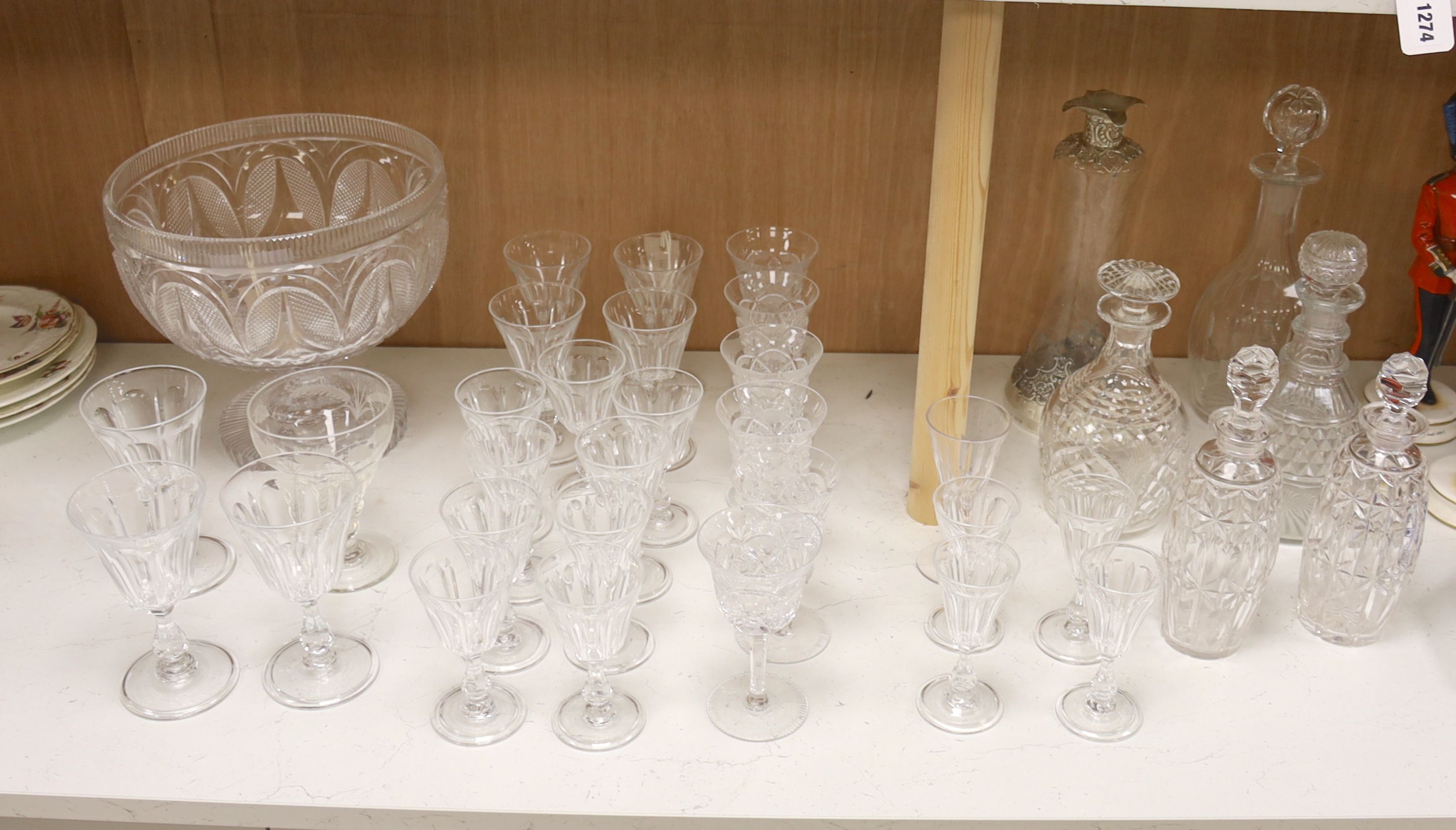 A cut glass punch bowl and a collection of table glassware, to include a late Victorian silver mounted decanter (lacking stopper)